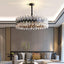 Napoli crystal modern chandelier by Morsale.com, a sculptural round fixture of genuine K9 crystal on sweeping stainless steel arms.