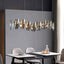 Lazzo linear crystal dining chandelier over a dining table