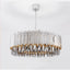 Legance modern chandelier by Morsale.com, distinctive smokey crystals on a polished stainless steel frame above a dining table.
