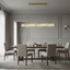 Bacci 60-inch linear crystal dining chandelier over a long table