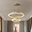 Bergamo clear crystal chandelier on a brushed steel frame in a living room
