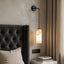 Mirasol marble wall sconce with glowing natural stone shade