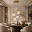 Moonshade cascading marble disc chandelier in an entryway