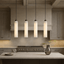 Noir black marble column pendant light full view