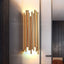 Vigo stainless steel wall sconce by Morsale.com, slender polished steel rods rising from a compact backplate with warm G9 LED light.