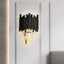 Vigo crystal wall sconce by Morsale.com, clear crystal on a black stainless steel frame casting warm E14 LED light.