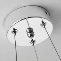 A cluster of Cadena chain tassel pendants by Morsale.com grouped above a kitchen island.
