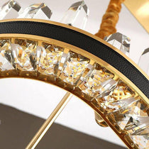 Angled view of the Villa 31-inch crystal wheel chandelier by Morsale.com, polished steel and hand-cut crystal.