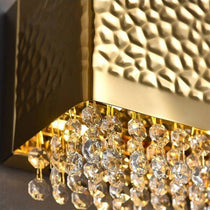 A pair of Bern gold crystal sconces by Morsale.com flanking a foyer mirror, warm symmetrical accent light.
