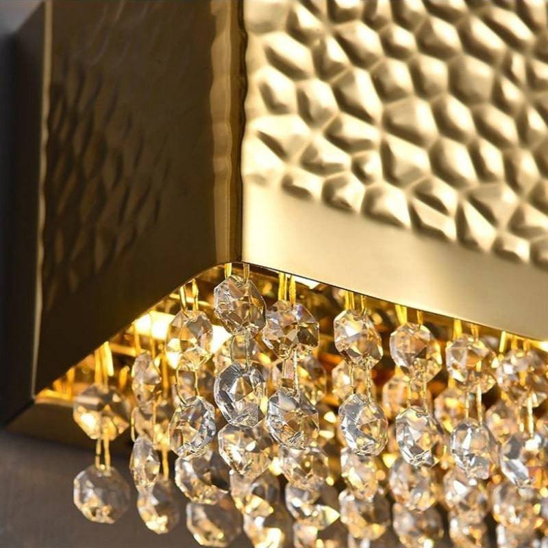 A pair of Bern gold crystal sconces by Morsale.com flanking a foyer mirror, warm symmetrical accent light.