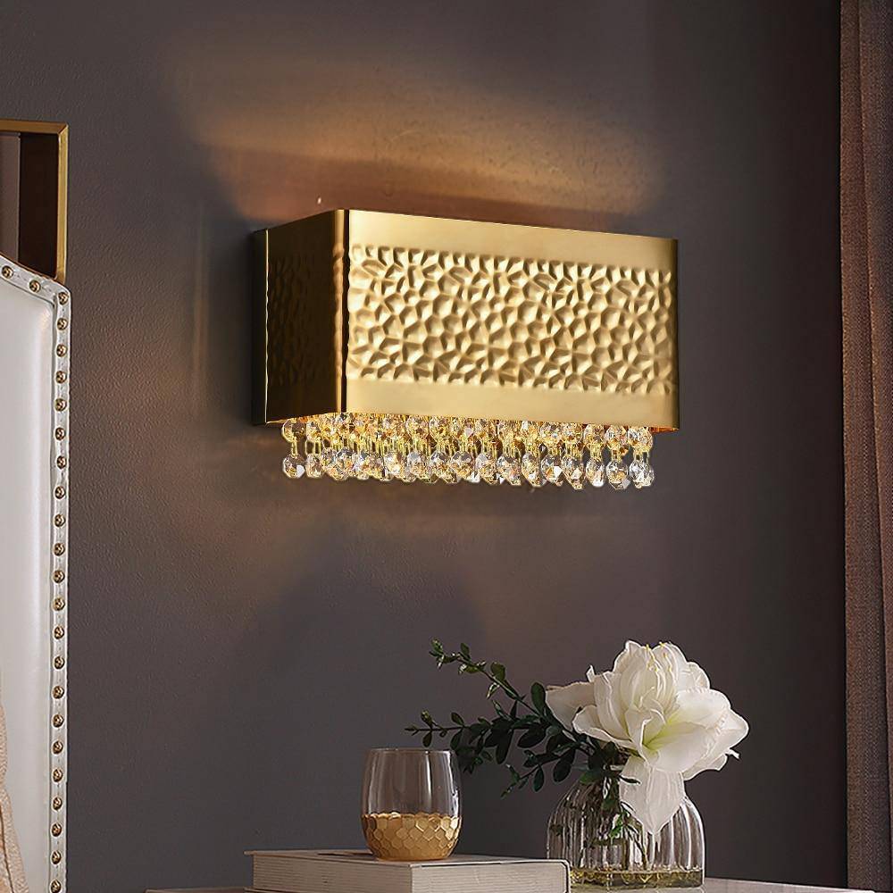 Bern gold plated wall sconce by Morsale.com, clear K9 crystal on a compact gold stainless steel frame casting soft warm light. Main image