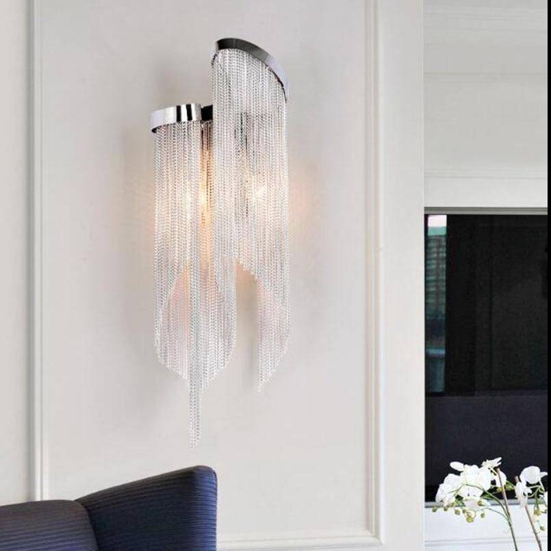 Cadena chain tassel wall sconce by Morsale.com, cascading aluminum tassels on a stainless steel backplate with two warm lights. Main image