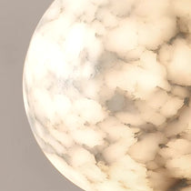 Solara marble orb pendant with brass detailing in a kitchen