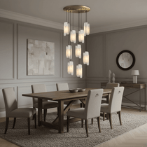 Lunara marble chandelier illuminated over a dining table