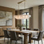Riviera oval clear glass chandelier over a dining table