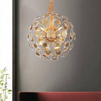 Dandelion crystal lighting fixture by Morsale.com, a 20-inch 9-light sphere with clear K9 crystal tips on a gold steel frame.