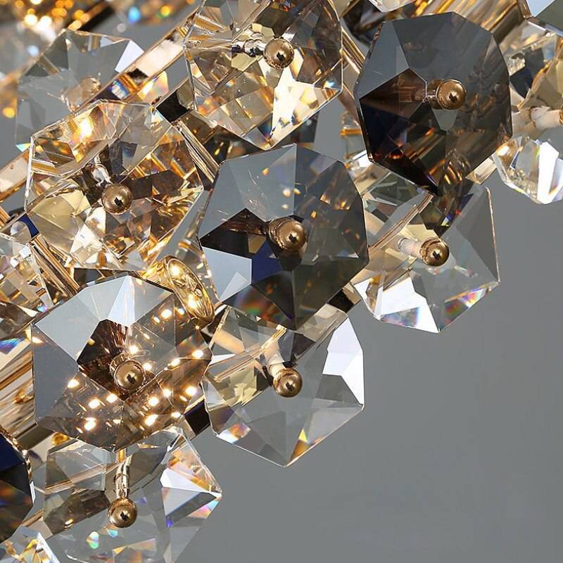 The Monte crystal wheel chandelier by Morsale.com lit in a living room, two-tone K9 crystal on a steel wheel.