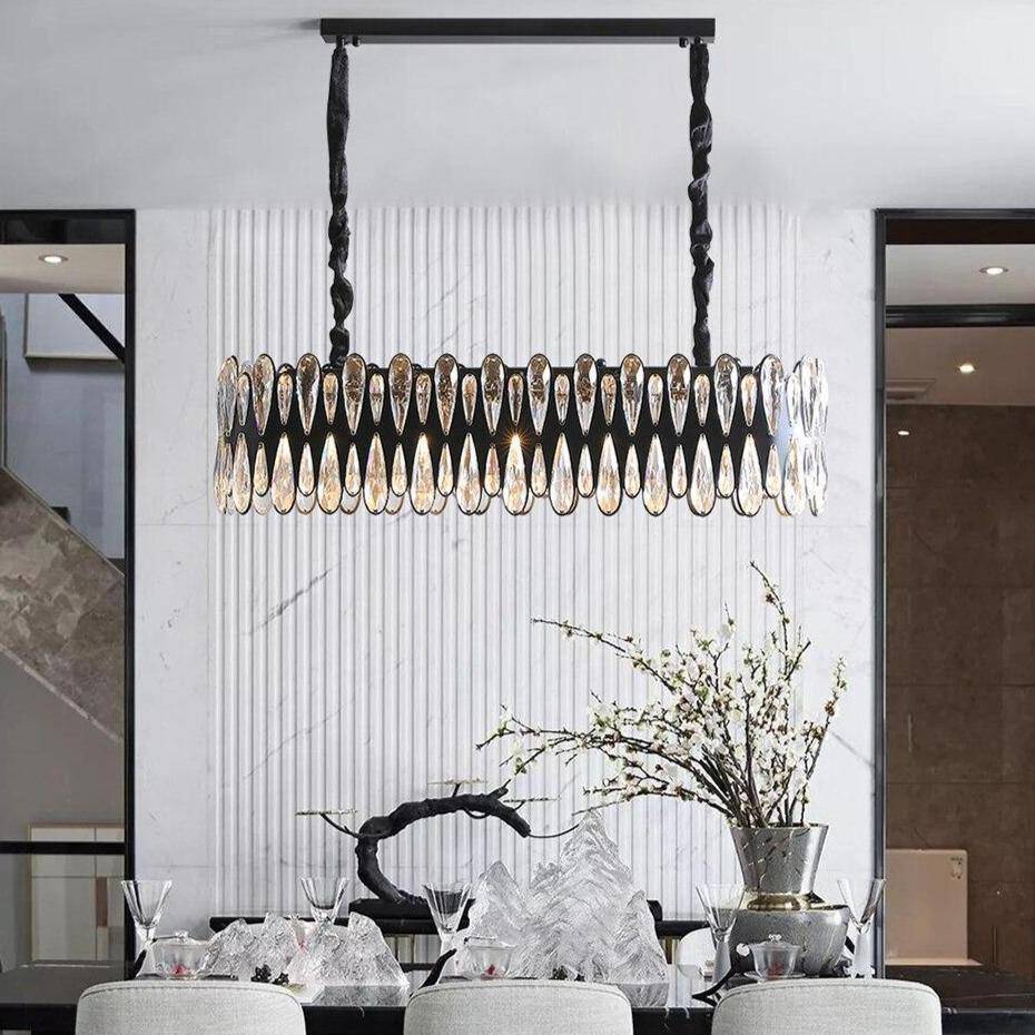 Napoli modern dining room chandelier by Morsale.com, a 36-inch linear fixture of K9 crystal on ornate stainless steel arms above a dining table.