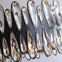 Detail of K9 crystal on the Napoli chandelier's ornate polished steel arms, from Morsale.com.