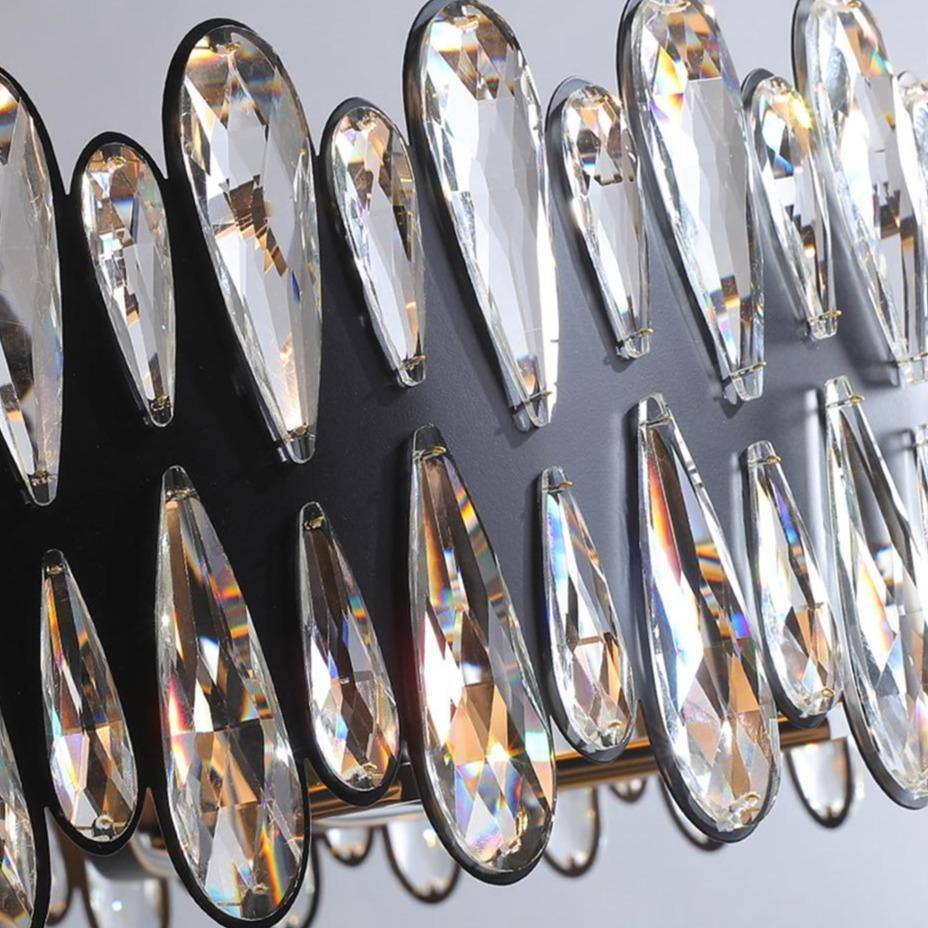 Detail of K9 crystal on the Napoli chandelier's ornate polished steel arms, from Morsale.com.