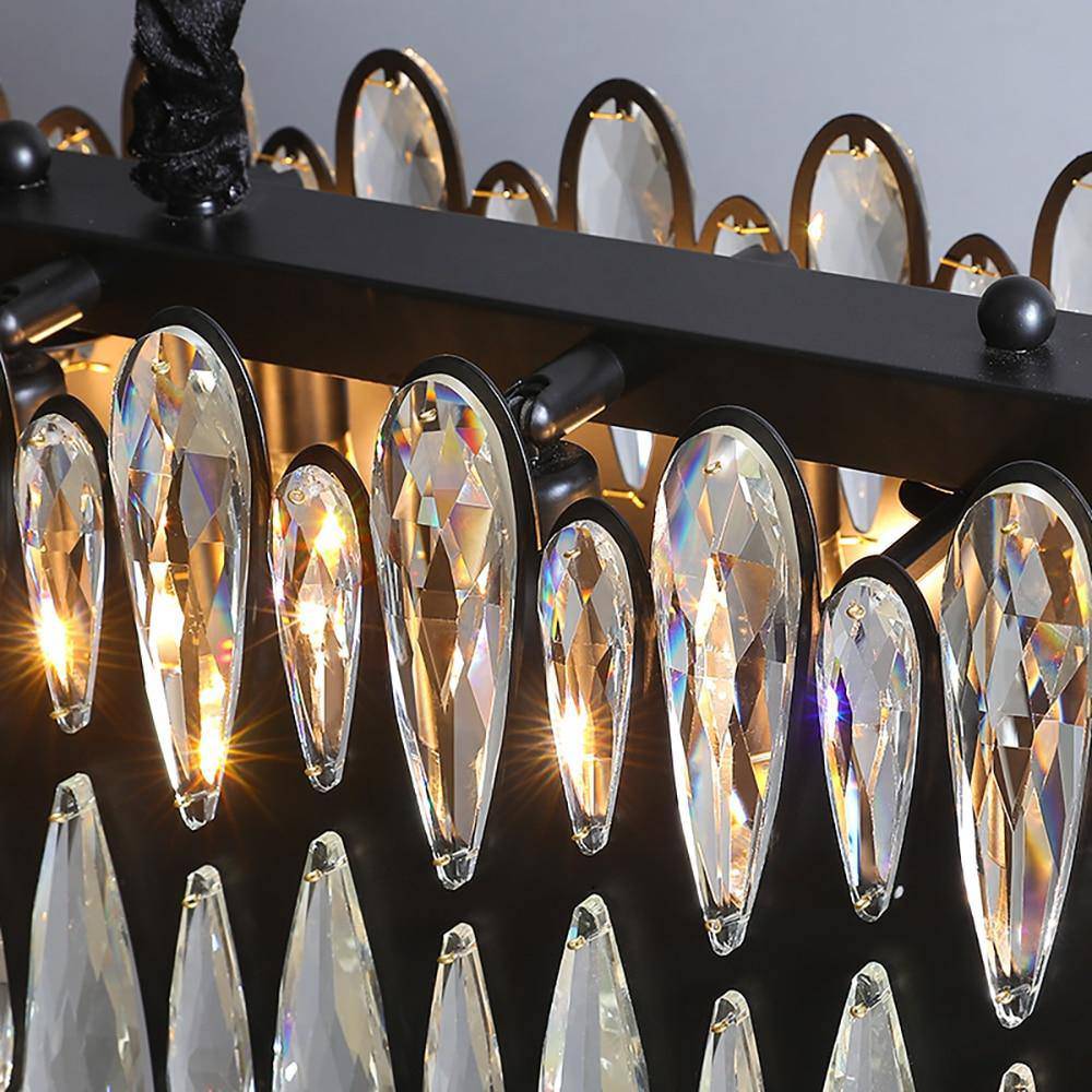The Napoli dining chandelier by Morsale.com lit over a bar, 36-inch K9 crystal on stainless steel.