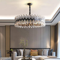 Napoli crystal modern chandelier by Morsale.com, a sculptural round fixture of genuine K9 crystal on sweeping stainless steel arms.