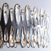 Side view of the Napoli round crystal chandelier by Morsale.com showing the organic architectural arm form.