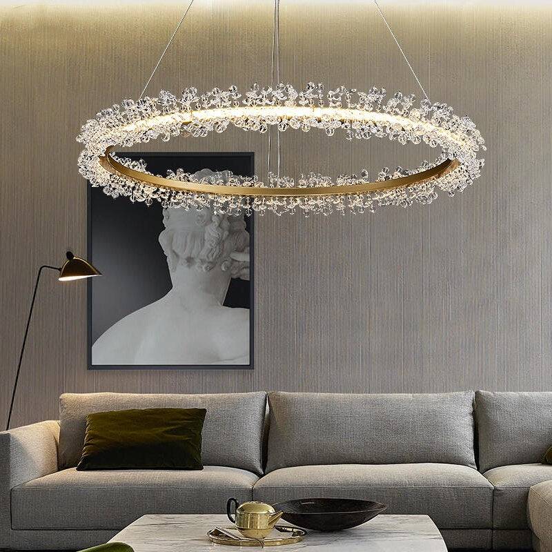 Capri 35-inch crystal ring chandelier illuminated over a dining table