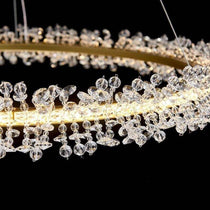 Capri crystal ring chandelier in a modern bedroom setting