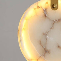 Moonshade marble chandelier warm glow through stone discs