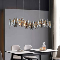Lazzo linear crystal dining chandelier over a dining table
