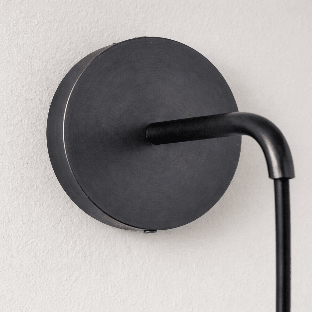 Mirasol marble wall sconce mounted in a hallway