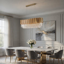 Gio gold crystal dining chandelier over a dining table