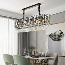 Molini minimalist dining chandelier in black over a table