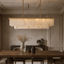 Beano 47-inch linear marble dining chandelier in brass