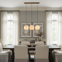 Auris 3-light linear marble chandelier illuminated