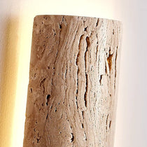 Solterra travertine sconce in a bathroom setting