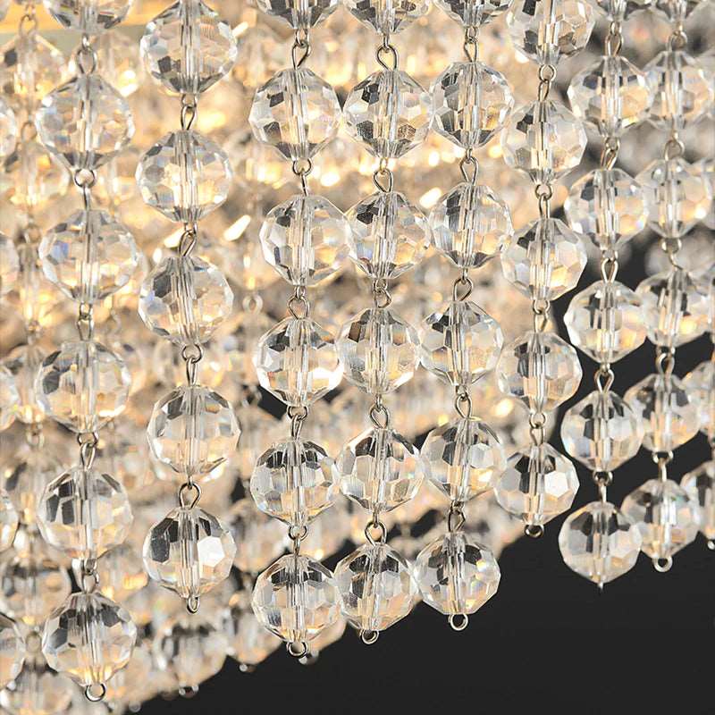 Alleri crystal dining chandelier illuminated above a kitchen island