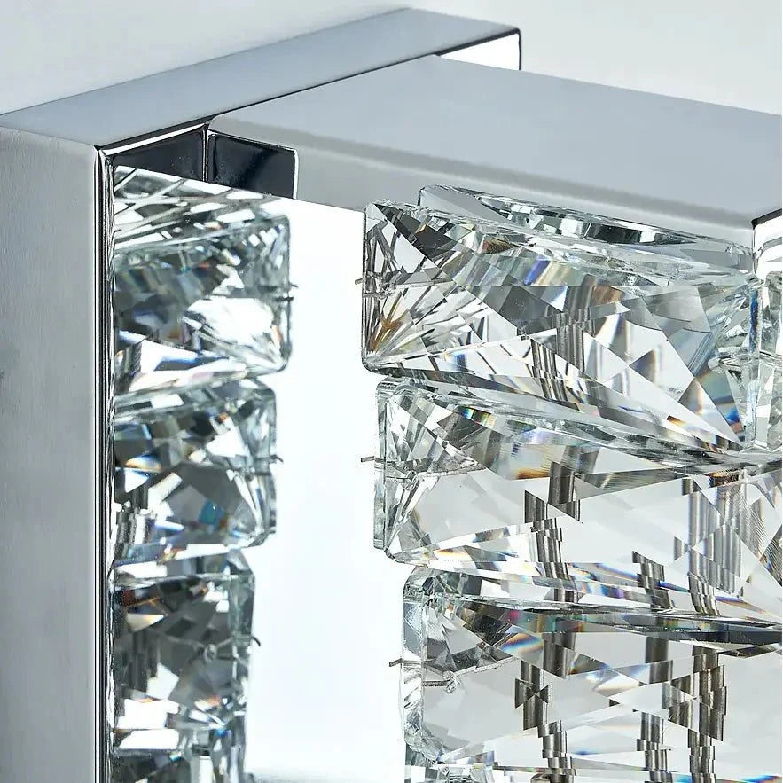 Bacci brass and crystal sconce mounted on a wall