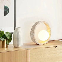 Solid natural travertine table lamp with warm LED glow