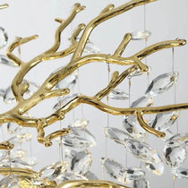 Albero modern crystal chandelier illuminated above a kitchen island