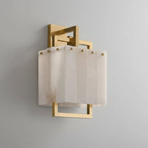 Stuart marble and brass wall sconce mounted on a wall