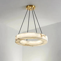 Palmer marble chandelier illuminated over a dining table
