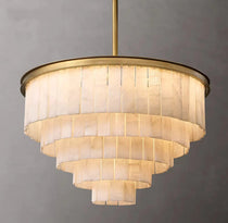 Berkley marble chandelier glowing warm in a living room
