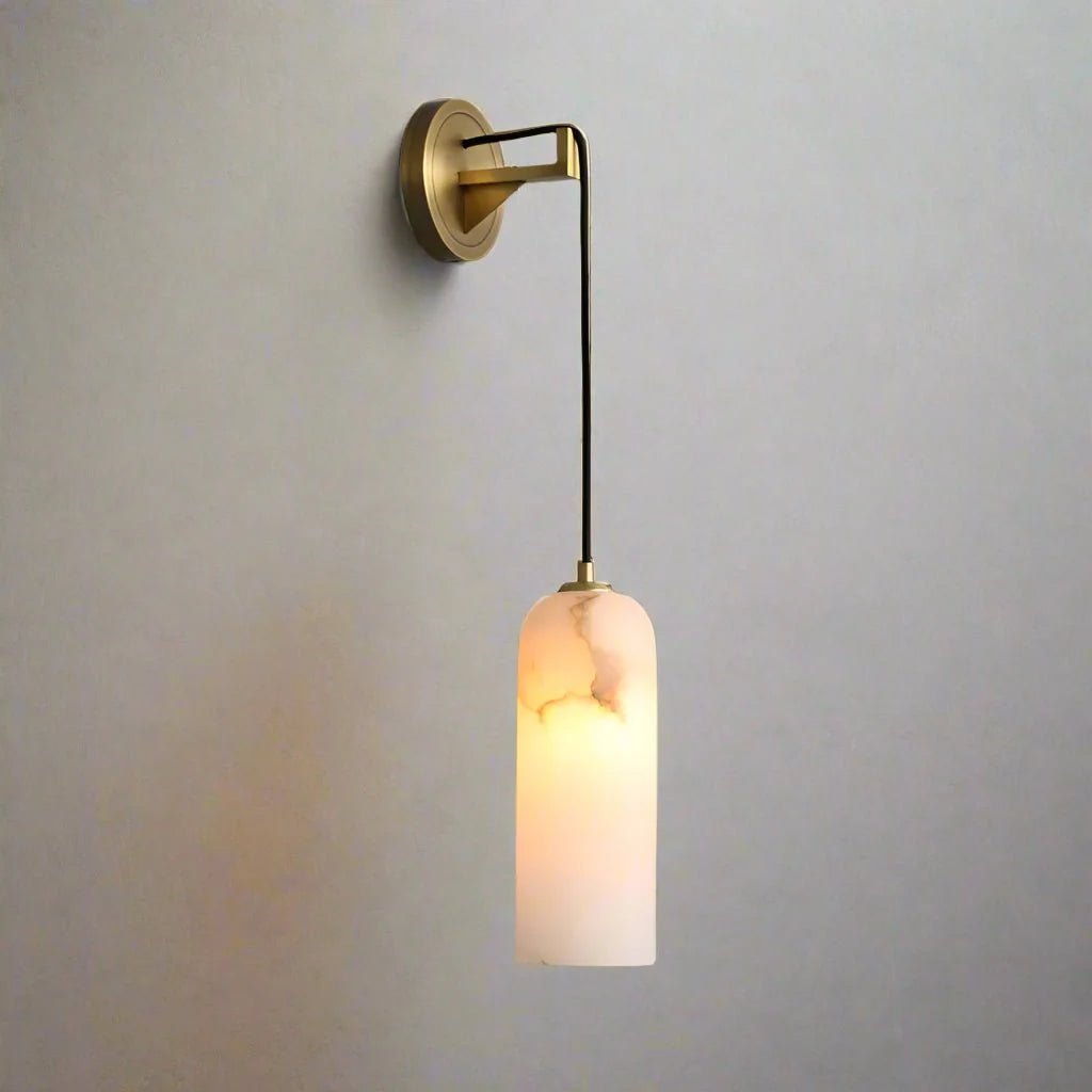 Lucera marble and brass wall sconce mounted on a wall