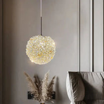 El Sol crystal pendant illuminated over a kitchen island