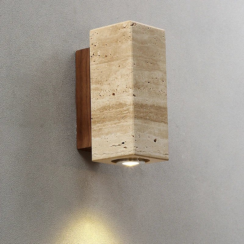 Natural travertine and walnut wall light in a hallway