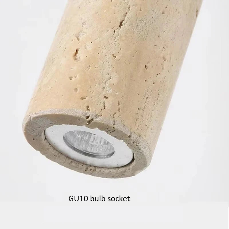Terra travertine wall sconce mounted on a wall