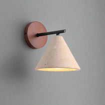 Siena travertine and wood wall sconce mounted on a wall