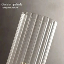Palermo brass and glass wall sconce in a hallway setting